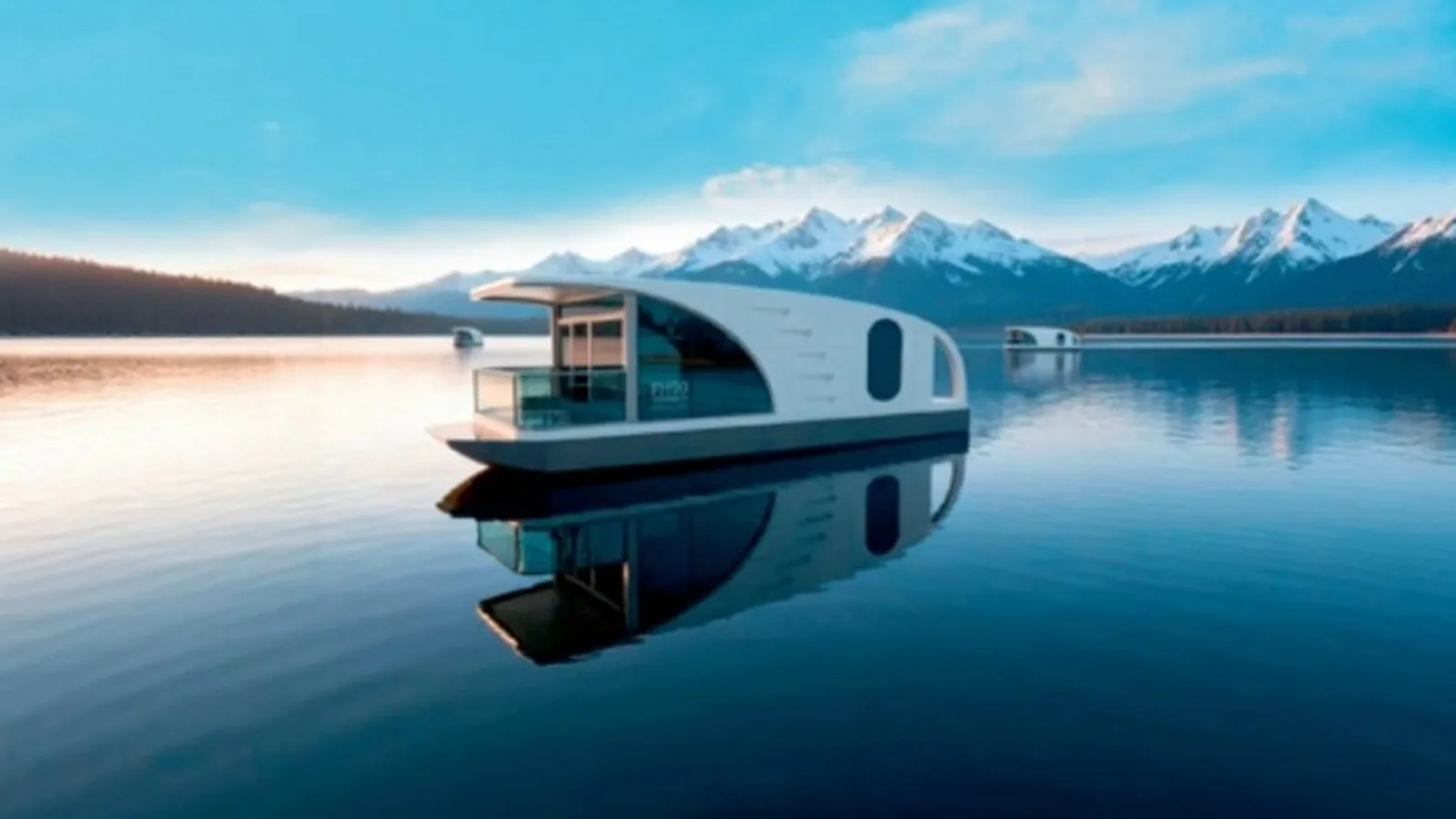 NATOR SIX modular cabin with a curved roof canopy and glazed frontage presented on a still waterfront setting