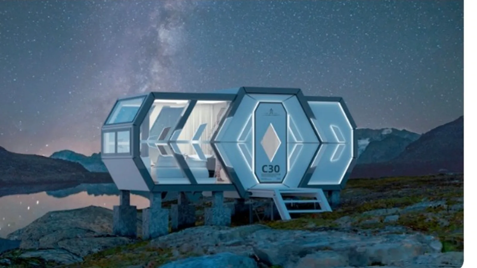 NATOR EIGHT segmented pod cabin with faceted glazed panels on a rocky alpine site at night