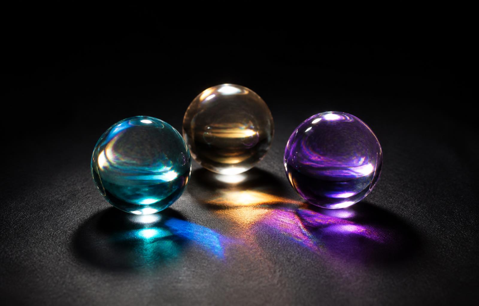 NATOR Ball Trio — three crystal-inspired fidget spheres each refracting different colours