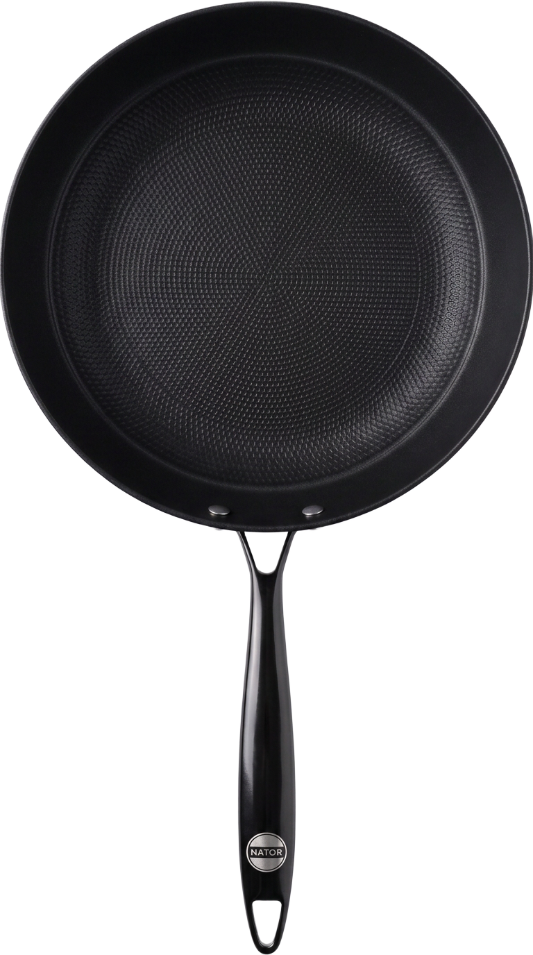 Nator Cookware frying pan lit against an obsidian background